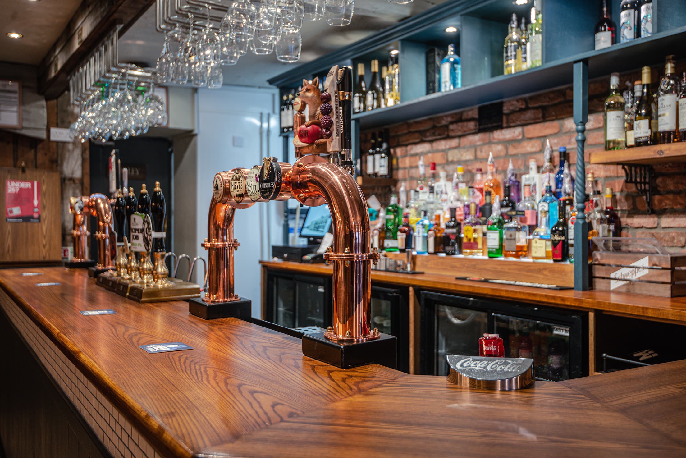 Bold Arms pub interior with fireplace and warm lighting